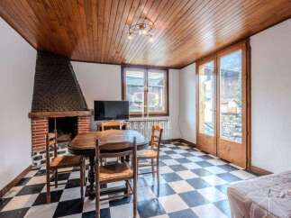 Discover a charming living space featuring a cozy fireplace, perfect for those chilly evenings.