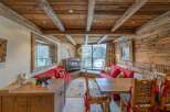 Experience rustic charm in this cozy living space, featuring a stunning wooden ceiling and walls.