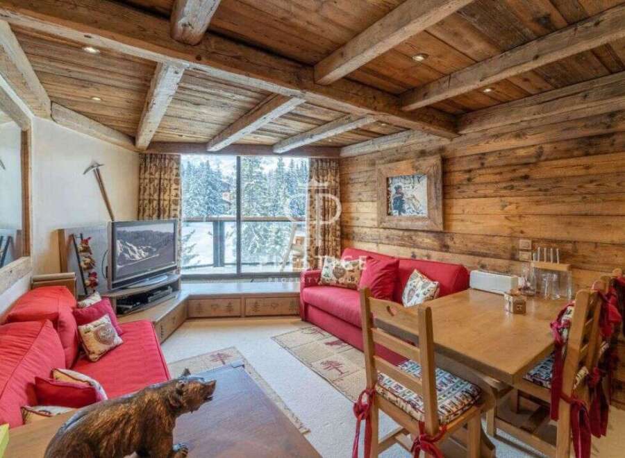 Experience the charm of this cozy chalet, featuring a rustic wooden interior and a warm, inviting atmosphere.