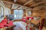 Experience the charm of this cozy chalet, featuring a rustic wooden interior and a warm, inviting atmosphere.