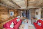 Experience rustic charm in this cozy chalet, featuring warm wooden interiors and a welcoming atmosphere.