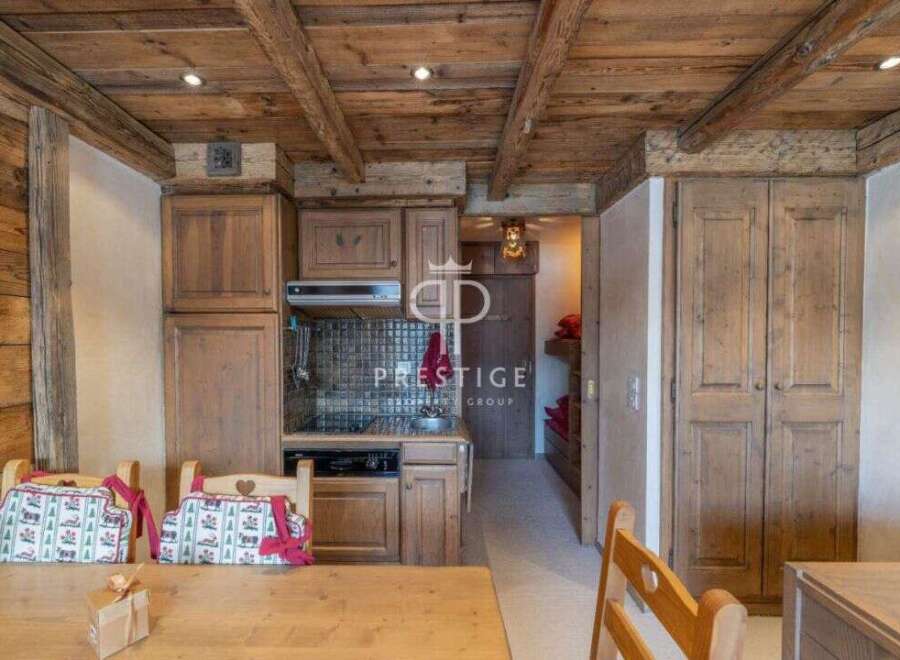 Discover the charm of this rustic kitchen, featuring wooden cabinetry and a cozy ambiance.
