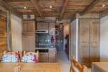 Discover the charm of this rustic kitchen, featuring wooden cabinetry and a cozy ambiance.