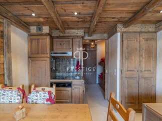 Discover the charm of this rustic kitchen, featuring wooden cabinetry and a cozy ambiance.