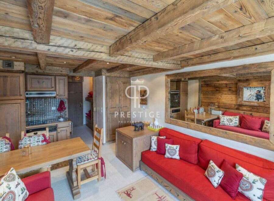 Discover the charm of this cozy property, featuring a rustic wooden ceiling and walls that exude warmth.