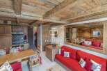 Discover the charm of this cozy property, featuring a rustic wooden ceiling and walls that exude warmth.