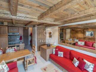 Discover the charm of this cozy property, featuring a rustic wooden ceiling and walls that exude warmth.