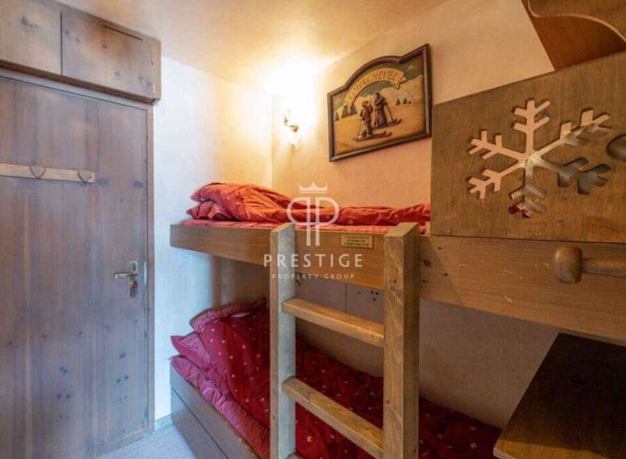 Cozy bunk beds offer a charming sleeping arrangement in this property.