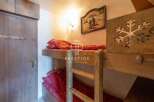 Cozy bunk beds offer a charming sleeping arrangement in this property.