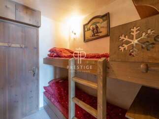 Cozy bunk beds offer a charming sleeping arrangement in this property.