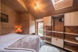 Experience rustic charm in this cozy bedroom.