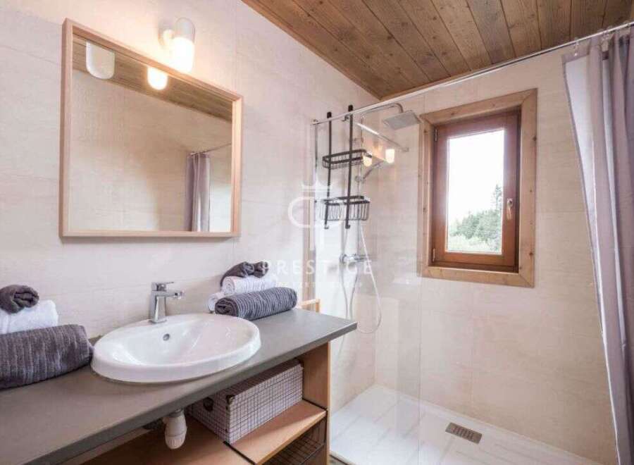 This charming bathroom features a modern design with a touch of rustic elegance.