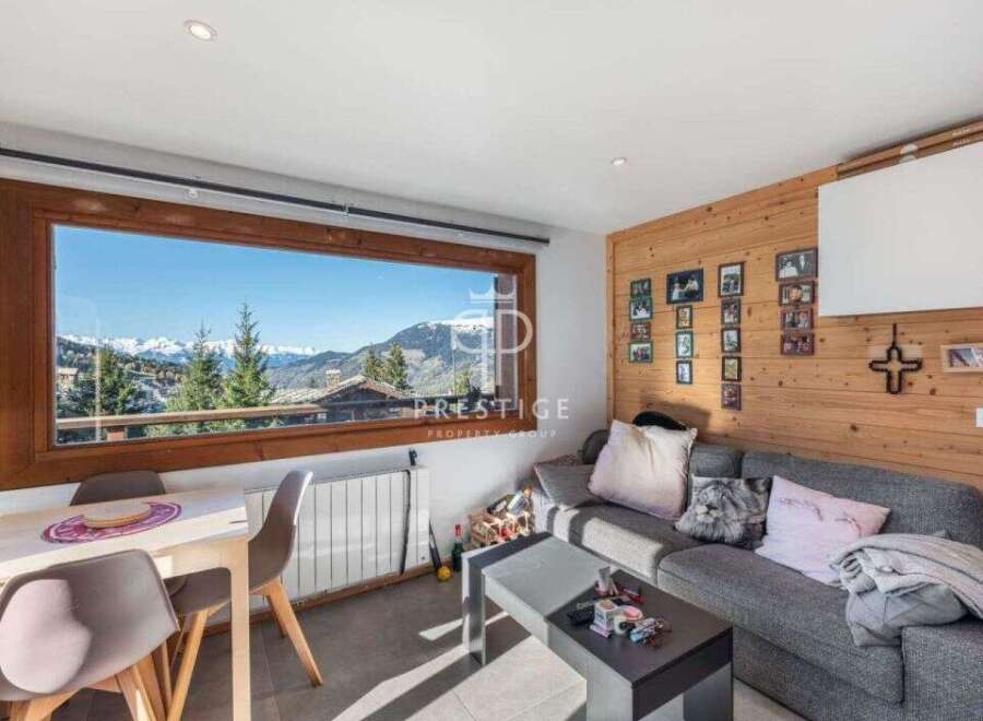 Experience breathtaking mountain views from this cozy living space.