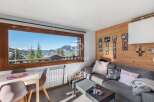 Experience breathtaking mountain views from this cozy living space.