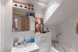 Discover this charming bathroom, featuring a modern sink and a convenient shower.