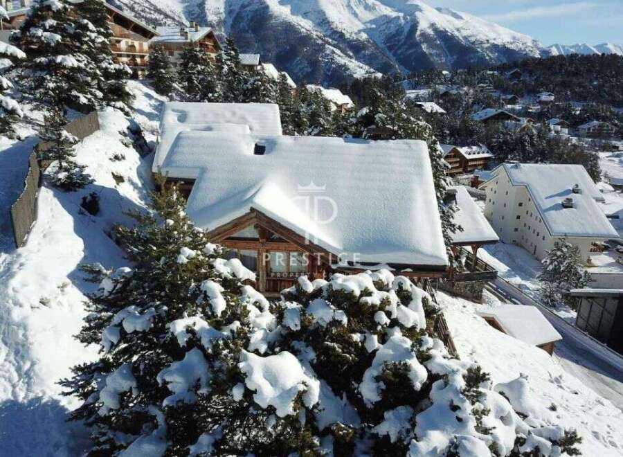 Discover a stunning mountain retreat nestled in a snowy landscape.