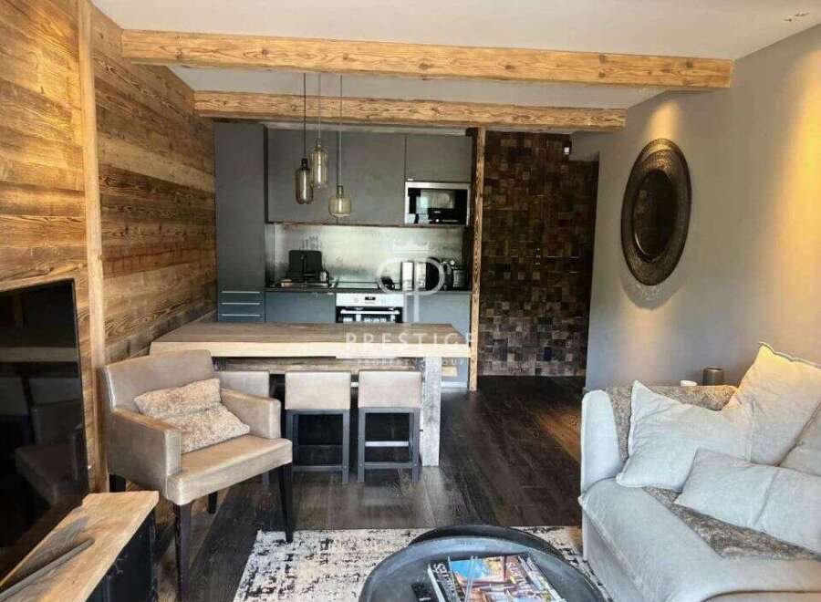 Experience luxury living in this stunning property, featuring a modern kitchen and stylish dining area.