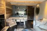Experience luxury living in this stunning property, featuring a modern kitchen and stylish dining area.