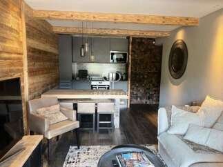 Experience luxury living in this stunning property, featuring a modern kitchen and stylish dining area.