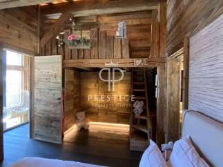 Experience rustic charm in this stunning wooden-clad property.