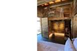 Discover rustic charm in this unique property, featuring stunning wooden architecture and a cozy loft space.