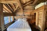Experience rustic luxury in this stunning wooden chalet.