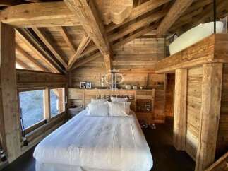 Experience rustic luxury in this stunning wooden chalet.