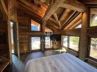Experience the charm of this stunning wooden chalet, boasting a cozy and inviting atmosphere.