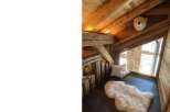 Discover a cozy retreat in this charming wooden cabin.