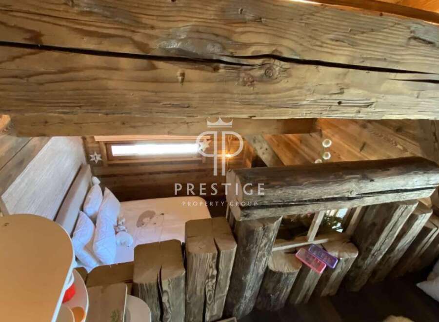 Discover rustic charm in this unique property! Featuring exposed wooden beams and a cozy loft space, this home offers a warm and inviting atmosphere.