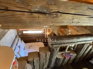 Discover rustic charm in this unique property! Featuring exposed wooden beams and a cozy loft space, this home offers a warm and inviting atmosphere.