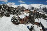 Discover a stunning mountain retreat nestled in a picturesque winter wonderland.