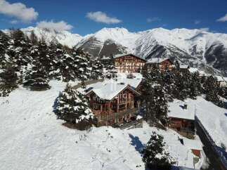 Discover a stunning mountain retreat nestled in a picturesque winter wonderland.