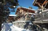 Discover a stunning chalet nestled in a winter wonderland.