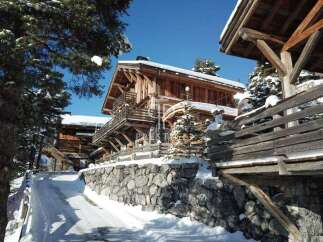 Discover a stunning chalet nestled in a winter wonderland.