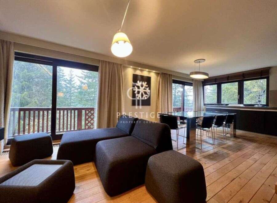 Discover luxury living in this stunning property, featuring expansive windows that frame breathtaking views of the surrounding nature.