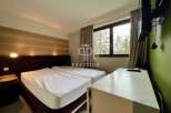 Discover a cozy bedroom with two comfortable beds, perfect for a relaxing stay.