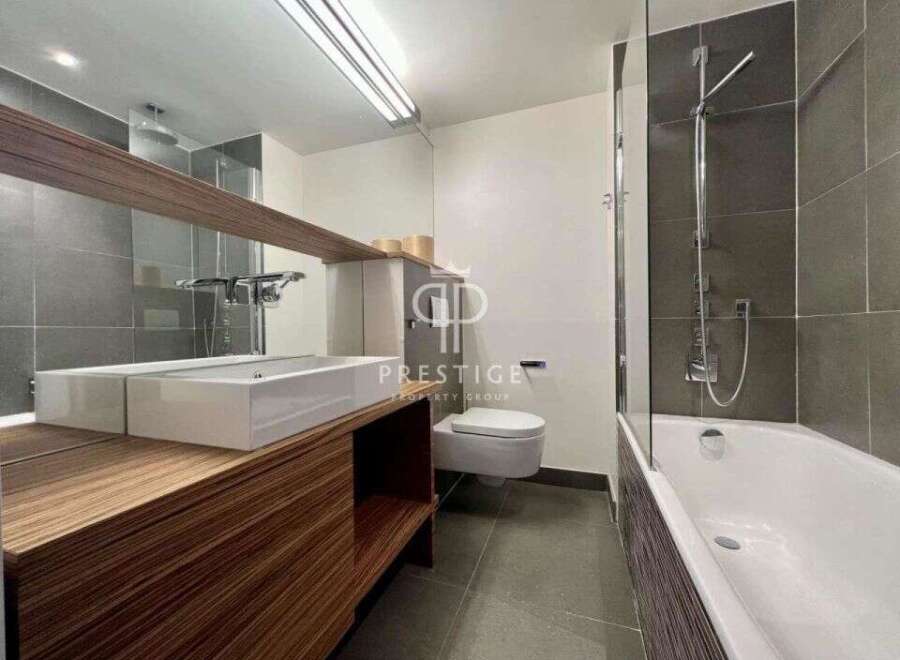 Modern bathroom design featuring a sleek vanity with a double sink and ample storage.