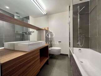 Modern bathroom design featuring a sleek vanity with a double sink and ample storage.