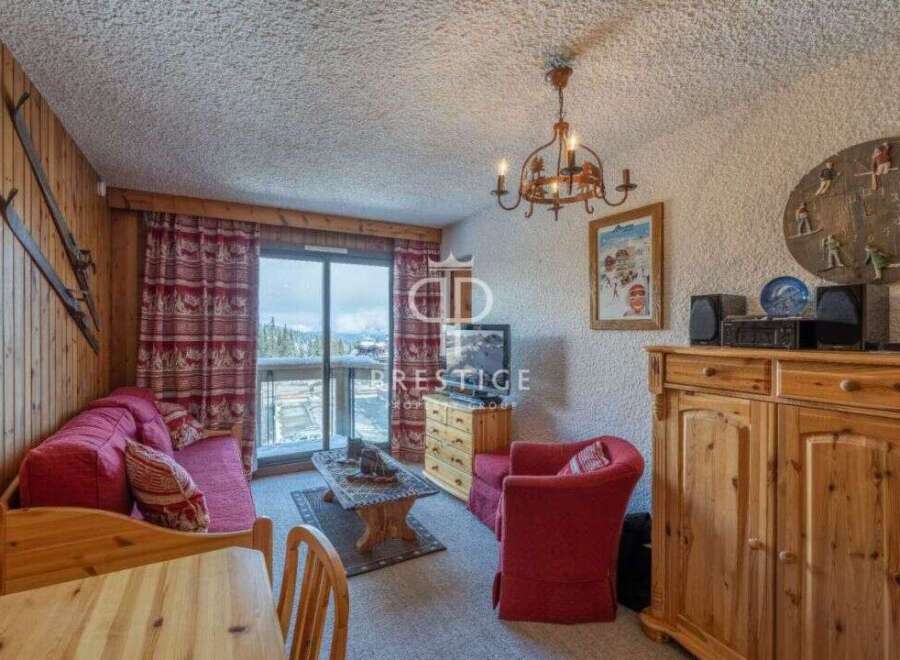 Cozy ski chalet living room with a rustic charm.