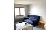 Discover this charming property featuring a cozy living space with a comfortable sofa.