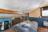 Discover this charming attic bedroom, perfect for a cozy retreat.