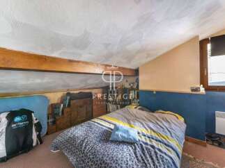Discover this charming attic bedroom, perfect for a cozy retreat.