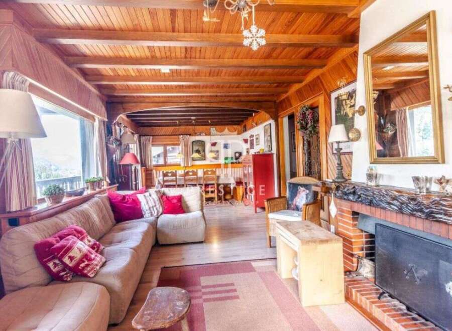 Step into a cozy chalet-style living room, perfect for relaxing.