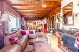 Step into a cozy chalet-style living room, perfect for relaxing.