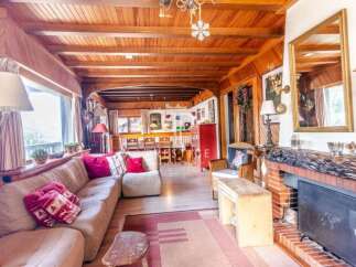 Step into a cozy chalet-style living room, perfect for relaxing.