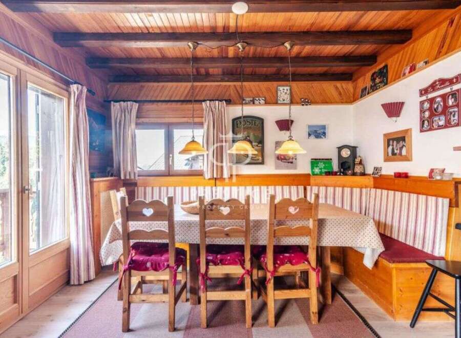 Step into a charming dining area with rustic wooden accents and a cozy atmosphere.