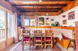 Step into a charming dining area with rustic wooden accents and a cozy atmosphere.