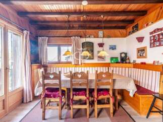 Step into a charming dining area with rustic wooden accents and a cozy atmosphere.