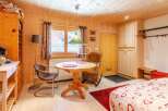 Cozy chalet-style interior with wooden walls and ceiling.